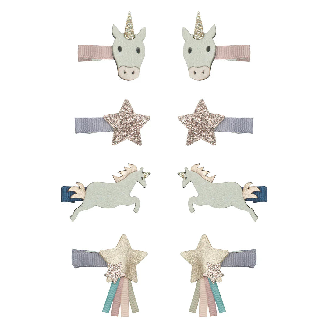 Acht minihaarclips met eenhoorns en glittersterren op roze, grijs en blauw lint, gerangschikt in vier paren.