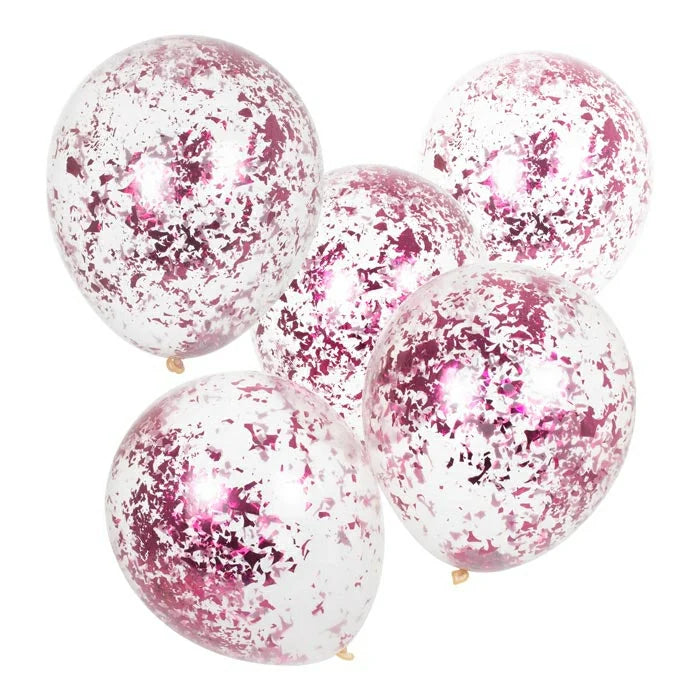Vijf transparante ballonnen met roze confetti tegen een witte achtergrond.