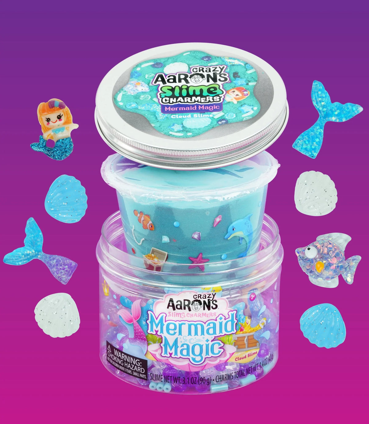 Mermaid Magic wolkenslijm in een geopende verpakking, omringd door zeemeermin-, vissen- en schelpenfiguurtjes.