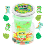 Geopende pot Crazy Aaron's Dino Dew met groen slijm, omringd door dinosaurus- en bladbedeltjes op witte achtergrond.