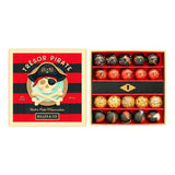 Open doos Pirate Treasure-knikkers met een zwart vak met sleutelgat, naast het rood-zwarte deksel met piratenschedel.