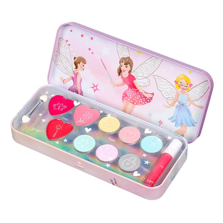 Geopende Souza make-updoos met elfjes op het deksel, kleurrijke lipgloss, oogschaduw en een borsteltje.