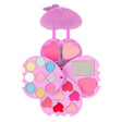 Opengevouwen roze make-up set Beauty van Souza met kleurrijke oogschaduw, hartvormige lipgloss, blush en spiegel