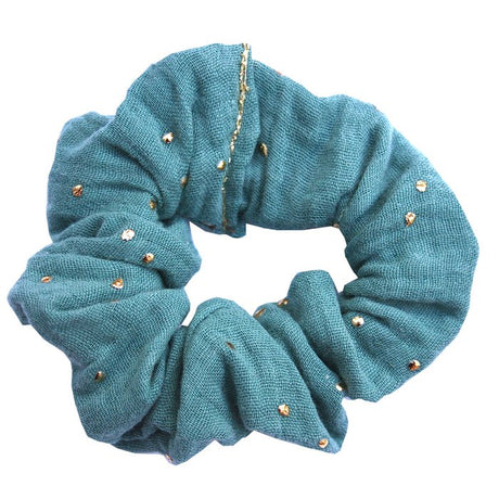 Petrolblauwe scrunchie van hydrofiel katoen met gouden spatjes.