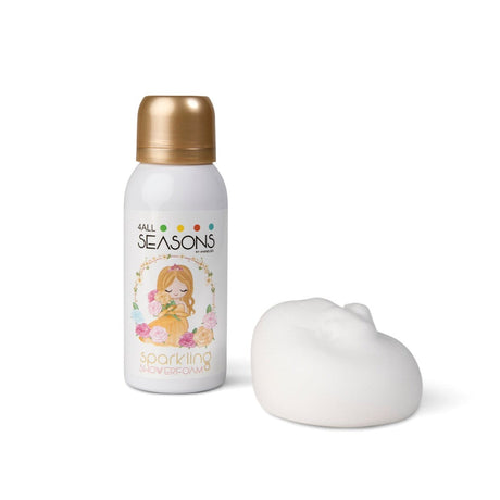Sparkling Princess doucheschuim in witte bus met goudkleurige dop en prinsessenillustratie, naast een toef wit schuim.