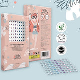 Roze La Dot-verpakking met een vel zelfklevende strass steentjes in verschillende kleuren.
