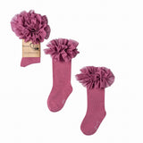 Heather Pink tutu kniekousen van Mama's Feet met roze ruches, los en met verpakking op een witte achtergrond.